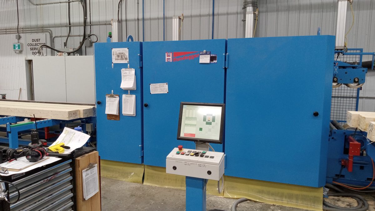 Four-sided planer used in mass timber fabrication to prepare timber components before site installation